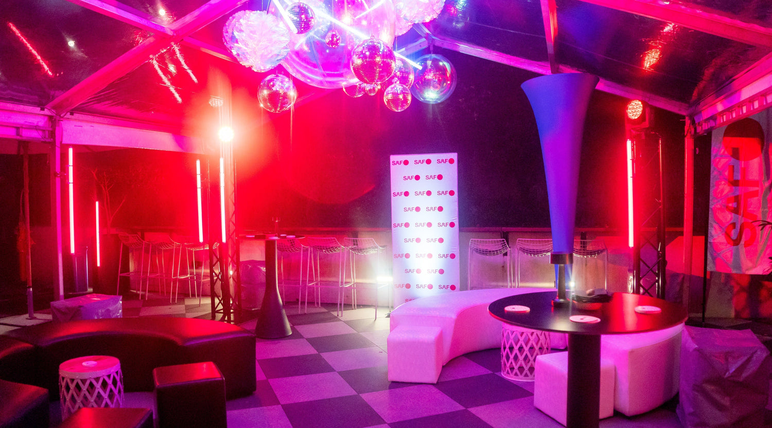 Cirque de Soleil themed cocktail event with enormous iridescent  inflatable balls suspended from the ceiling